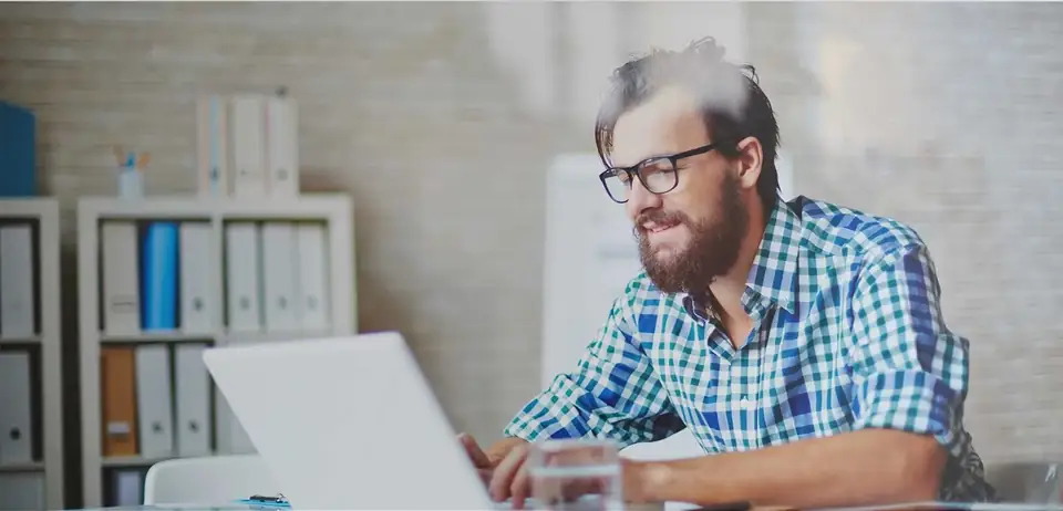 Professional editor reviewing a document at a laptop