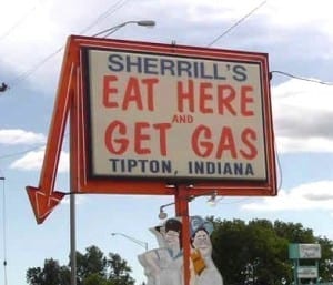 Sign reads: "eat here and get gas"