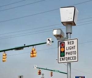 Sign reads: "red light photo" the camera is covered though