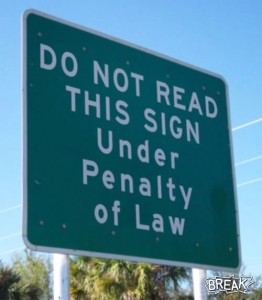 Sign reads: "do not read this sign under penalty of law."
