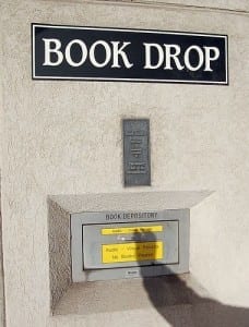 Sign reads: "book drop" and then "no books"