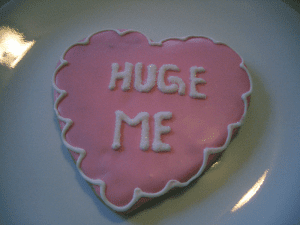 Cake reads: "huge me"