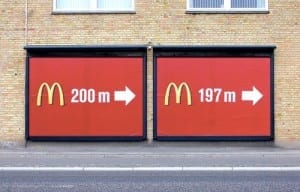 Two Mcdonalds signs side by side give incorrect information