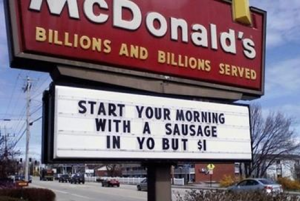 Sign reads: "start your morning with a sausage in yo but"