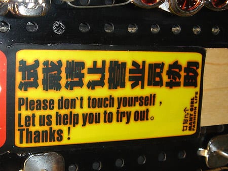 bad translations five Badly translated sign tells vehicle owner not to touch themselves