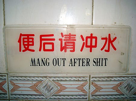 bad translations seven' Sign reads: "mang out"
