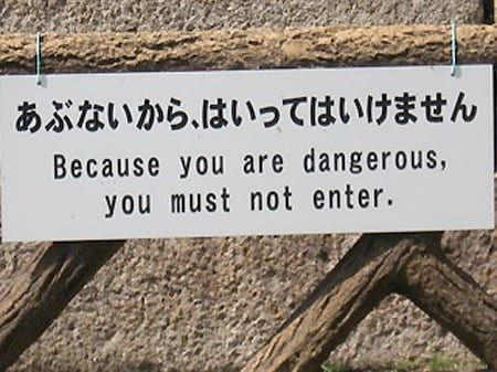 Sign reads: "because you are dangerous you must not enter"