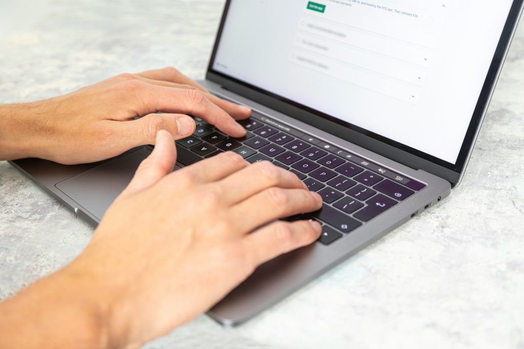 Picture of someone typing on a keyboard